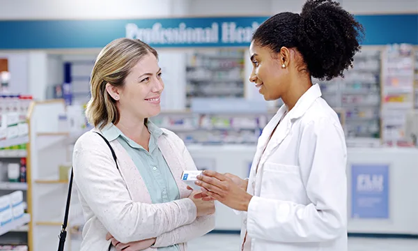 Cold and Cough - photo of a Pharmacist talking with a patient